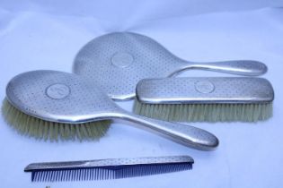 Four hallmarked silver dressing table items