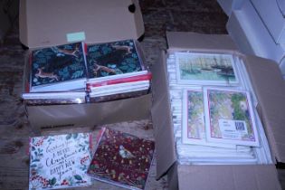 A box of new sealed Christmas cards and a box of new postcards. Shipping not available.