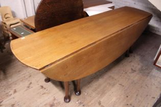 A late 18th/early 19th century oak double drop leaf hunt table L240cm, approx 160cm with both