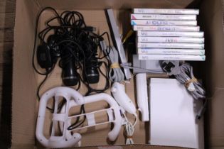 A Wii console with accessories and games (in working order)