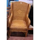 A vintage wicker work wingback arm chair. shipping unavailable