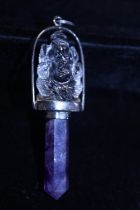 A Crystal and Amethyst pendant