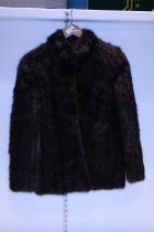A ladies brown fur coat size S