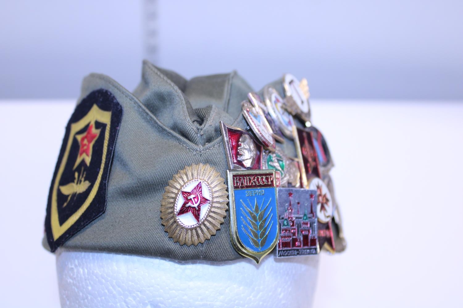 A Russian military cap with a large selection of enamelled badges - Image 3 of 3