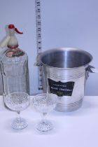 A vintage aluminium champagne bucket, vintage soda syphon and two cut glasses