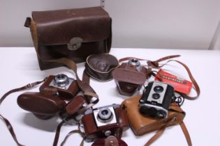 A selection of vintage cameras and binoculars