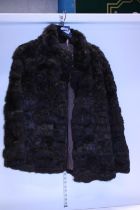 A ladies fur coat size 16