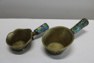 A pair of Chinese enamelled silk irons