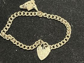 A hallmarked silver bracelet and charm. 12.97 grams.