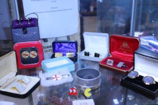 A selection of assorted novelty cufflinks