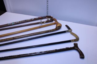 A job lot of assorted walking sticks and canes. Shipping unavailable