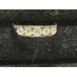 A stamped 18ct gold ring set with five diamonds 2.68g
