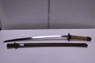 A vintage Samurai sword in leather scabbard. Length of the nagasa is 25.5 inches. shipping