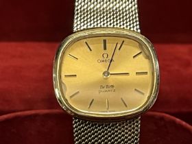 A boxed ladies Omega Deville gold plated quartz watch with paperwork (untested)