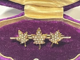 A antique 14ct gold bar brooch with seed pearl decoration 2.71g. (Pin is also in 14ct gold)