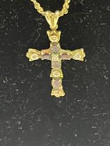 A diamond and amethyst jewelled cross and chain