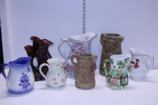 A quantity of assorted ceramic jugs, shipping unavailable