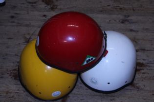 Three mountaineering/saftey helmets