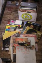 A box of mixed genre LP records. Shipping unavailable