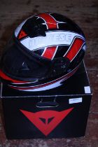 A boxed DAINESE crash helmet