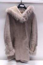 A ladies sheepskin and fur coat