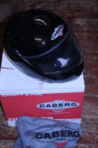 A boxed Caberg crash helmet