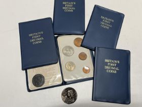 Five first decimal coin sets along with a Leeds half penny token for 1791 and one other coin