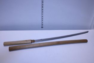 A wooden handled samurai sword in wooden scabbard. Length of the nagasa is 25.25 inches. shipping