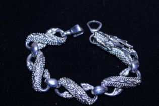 A 925 silver bracelet in the form of a Dragon 37gms.