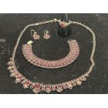 A set of silver jewellery necklace, earrings, bracelet and ring