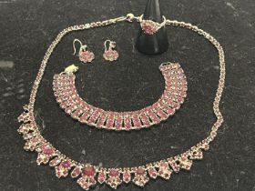A set of silver jewellery necklace, earrings, bracelet and ring