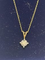 A 9ct gold chain and pendant set with a diamond solitaire. 1.19 gms