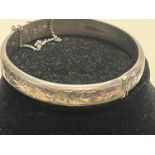 A hallmarked silver bangle. 13.54 grams & 6cm internal diameter