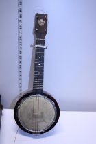 A antique Keech ukulele in original case