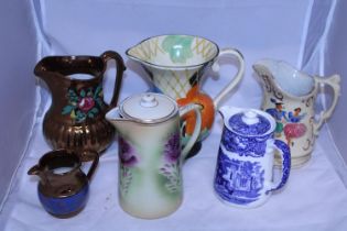 A job lot of assorted ceramic jugs