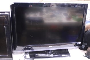 A LG flat screen TV 38" screen working with remote, shipping unavailable