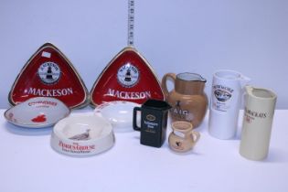 A job lot of assorted brewiana including whisky jugs & ashtrays etc.