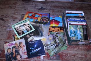 A box of mixed genre LP records. Shipping unavailable