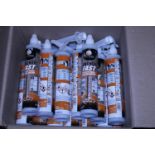 A box full of new tubes of Anchoring Adhesive