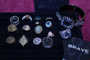 A selection of costume jewellery rings and a box set of Brave costume jewellery