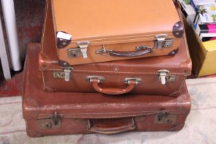 Three vintage suitcases, shipping unavailable