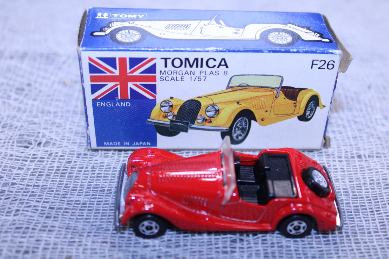 A boxed Tomica F26 die-cast model
