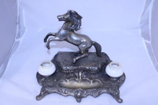 A antique base metal ink stand