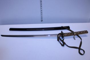 A vintage Samurai sword in scabbard, slight damage to thread on handle, 59cm blade length,