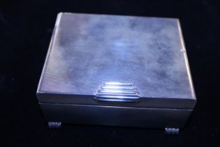 A good quality hallmarked silver Art Deco period cigarette box with boxwood lining