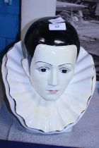 A ceramic bust of a Pierrot clown