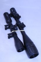 Two rifle scopes, a Hawke 3-9x40 and a 6-24x50 AOEG