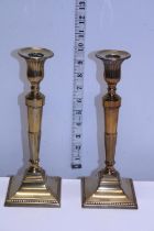 A pair of Victorian brass candlesticks