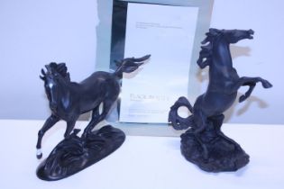 Two Franklin Mint horse figurines 'Battling Stallions & Black Beauty'