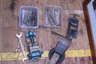 A selection of vices and drill bits, shipping unavailable